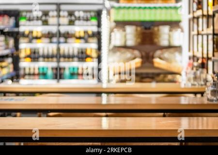 Empty wooden table top on blur interior restaurant or cafe background. Product display template. Business presentation Stock Photo
