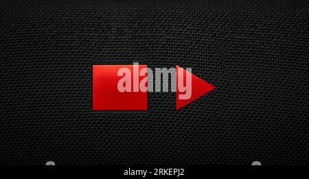 Stop and Play button on a black textile background. Video player Stock Photo