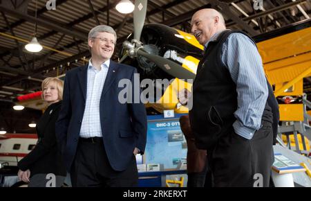 Prime Minister Stephen Harper, centre, smiles with Herman Van Rompuy, left,  President of the European Council, and JosÃƒÂ© Manuel Barroso, right,  President of the European Commission at the Canada-European Union Summit in