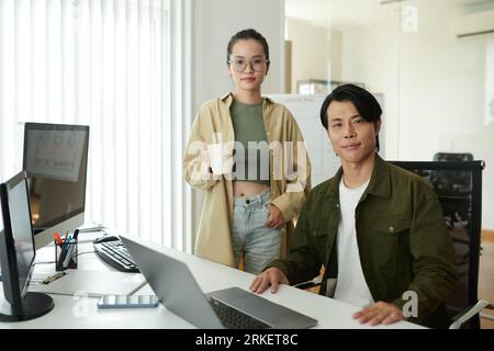 Team of young software developers working in office Stock Photo
