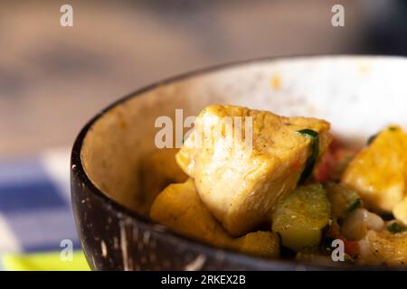 Oriental chicken stew served in a rustic bowl. Exotic food. Close up. Selective focus Stock Photo