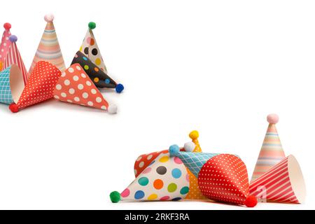 A group of bright and colorful birthday caps isolated on a white background. Holidays cocept. Stock Photo
