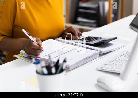 African American Business Accountant In Office Doing Accounting Work Stock Photo