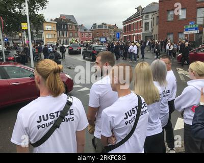 Herstal, Belgium. 25th Aug, 2023. People with bikes and in cars and some wearing shirts that reads 'Justice pour Drom's' are seen outside the church, after the funeral ceremony for the young man shot dead by the police on 18 August in Oupeye after running over a policeman with his quad bike, Friday 25 August 2023 in Herstal. BELGA PHOTO Credit: Belga News Agency/Alamy Live News Stock Photo