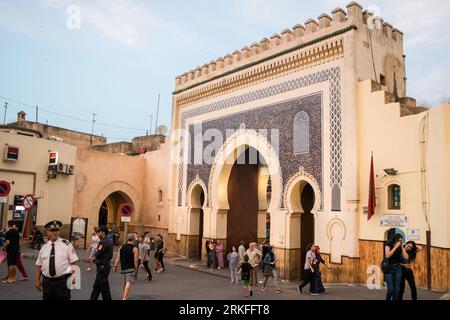 Bab Bou Jeloud, one of the main entrances to the old city medina of Fez. An ornate decorated city gate in Morocco during sunset. Stock Photo