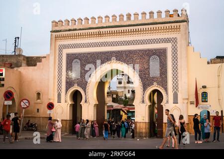 Bab Bou Jeloud, one of the main entrances to the old city medina of Fez. An ornate decorated city gate in Morocco during sunset. Stock Photo