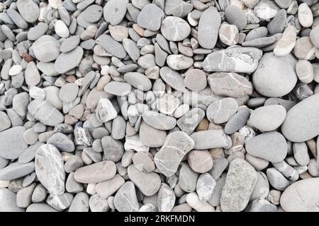 Background of gray pebbles, pebble beach Stock Photo