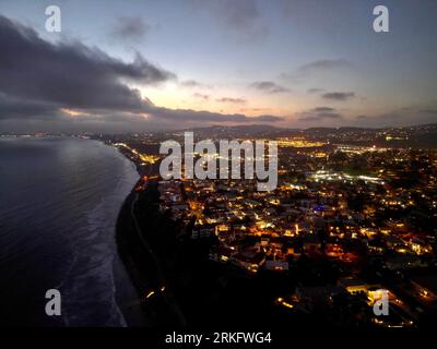 A stunning aerial view of a vibrant city skyline along a waterfront ...