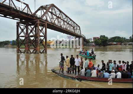 The traditional Sylhet's historic 'Keane Bridge over the Surma River in Sylhet has become vulnerable, with vehicular and human traffic is closed for renovation work. In order to preserve this heritage structure built during the British period, the bridge division of the Eastern Railway has begun renovation work. Apart from using two other bridges in the city, people also cross the Surma River by boats in Kinbridge Chandnighat area. Sylhet, Bangladesh. Stock Photo