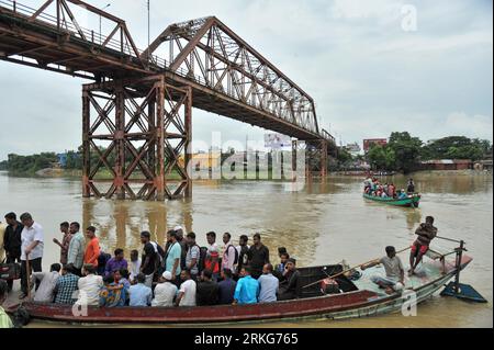 The traditional Sylhet's historic 'Keane Bridge over the Surma River in Sylhet has become vulnerable, with vehicular and human traffic is closed for renovation work. In order to preserve this heritage structure built during the British period, the bridge division of the Eastern Railway has begun renovation work. Apart from using two other bridges in the city, people also cross the Surma River by boats in Kinbridge Chandnighat area. Sylhet, Bangladesh. Stock Photo