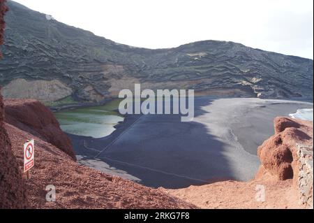A spectacular view of El Lago Verde at the base of a volcanic crater in Spain Stock Photo
