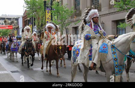 Bildnummer: 55583233  Datum: 08.07.2011  Copyright: imago/Xinhua (110711) -- CALGARY, July 11, 2011 (Xinhua) -- Aboriginal parade in downtown Calgary, Alberta, Canada, on July 9, 2011. The 99th Calgary Stampede started in Calgary on July 8, 2011. The 10-day fair, known as the world s largest outdoor rodeo, attracts over 1 million visitors from all over the world. (Xinhua/Huang Xiaonan) (zcc) CANADA-CALGARY-RODEO PUBLICATIONxNOTxINxCHN Gesellschaft Kultur Rodeo Land Leute Pferd Tiere premiumd xns x0x 2011 quer     Bildnummer 55583233 Date 08 07 2011 Copyright Imago XINHUA  Calgary July 11 2011 Stock Photo