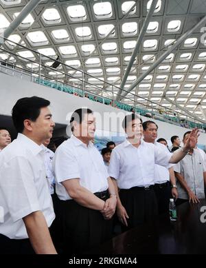 Bildnummer: 55606114  Datum: 18.07.2011  Copyright: imago/Xinhua (110720) -- BEIJING, July 20, 2011 (Xinhua) -- Zhou Yongkang (2nd L, front), a member of the Standing Committee of the Political Bureau of the Communist Party of China (CPC) Central Committee and secretary of the CPC Central Commission for Political and Legal Affairs, listens to introductions on preparations for the upcoming World University Games (Universiade) in the Shenzhen Bay Sports Center, also known as Spring Cocoon, in Shenzhen, south China s Guangdong Province, July 18, 2011. Spring Cocoon would be the venue for the open Stock Photo