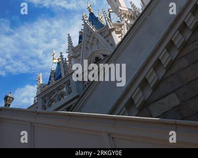A large blue and white palace made of brick with bits of gold detailing Stock Photo