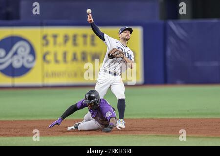 Colorado Rockies left fielder Jurickson Profar (29) wears a pair of Nike  cleats featuring the face of the team's mascot, Dinger the dinosaur, in the  ninth inning of a baseball game Tuesday