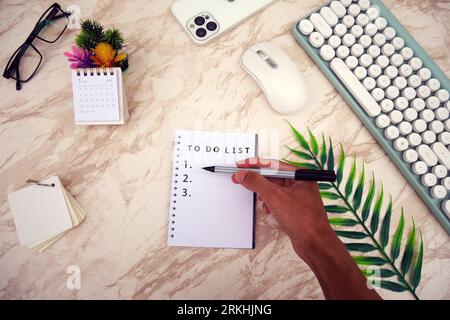 To do list in spiral notepad. Creativity and inspiration work concept. Top view flat lay. Stock Photo