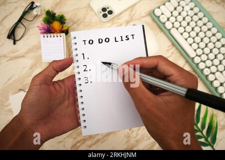 To do list in spiral notepad. Creativity and inspiration work concept. Top view flat lay. Stock Photo
