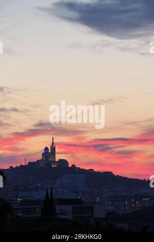 A scenic view of the bustling city of Marseille, France during sunset Stock Photo