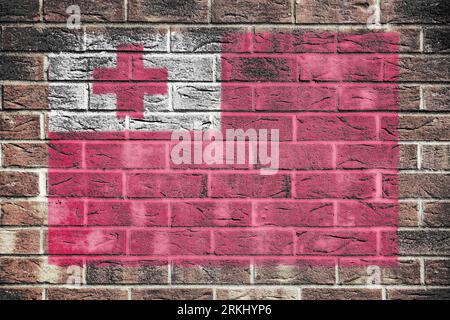 Tonga flag on a brick wall background Stock Photo