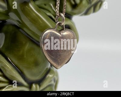 A closeup of a necklace in shape of a silver heart Stock Photo