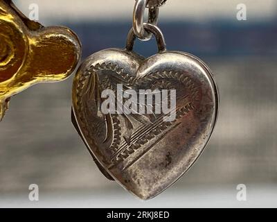 A closeup of a necklace in shape of a silver heart Stock Photo