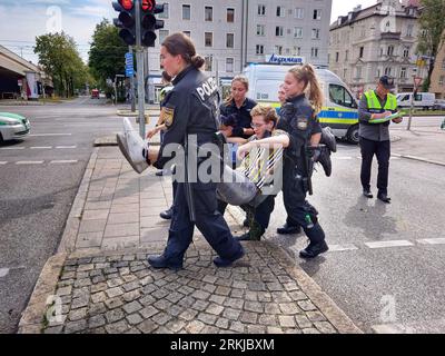 Munich, Bavaria, Germany. 25th Aug, 2023. For a second day in a row, the Letzte Generation climate activists held a street blockade in Munich, Germany. Letzte Generation (Last Generation) climate activist group planned to carry out actions throughout Munich as they worked their way south. (Credit Image: © Sachelle Babbar/ZUMA Press Wire) EDITORIAL USAGE ONLY! Not for Commercial USAGE! Stock Photo