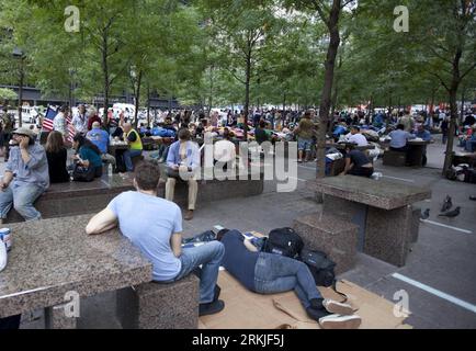 Bildnummer: 56130959  Datum: 27.09.2011  Copyright: imago/Xinhua (110927) -- NEW YORK, Sept. 27, 2011 (Xinhua) -- Protesters sit at a plaza near the Wall Street in New York, the United States, on Sept. 27, 2011. After several streets around the Wall Street have been blockaded since Sept. 16, protesters pitched their tents at the Bowling Green and Battery Park to continue their demonstration. (Xinhua/Fan Xia) US-NEW YORK-WALL STREET-PROTEST PUBLICATIONxNOTxINxCHN Gesellschaft Protest USA x0x xtm premiumd 2011 quer  Bewegung besetzt die     56130959 Date 27 09 2011 Copyright Imago XINHUA  New Yo Stock Photo