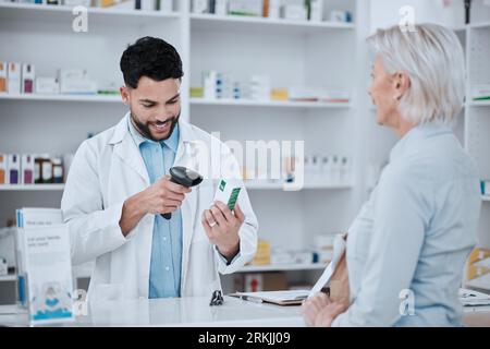 Happy man, pharmacist and scanning box for customer in consultation, medication or pills at pharmacy. Male person, medical or healthcare employee Stock Photo