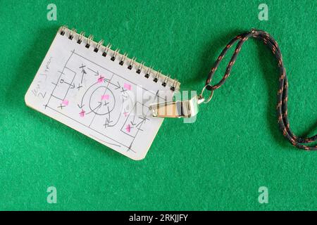 soccer tactics scribble on notepad and whistle of soccer referee or trainer. Great soccer event this year, soccer championship concept. Stock Photo