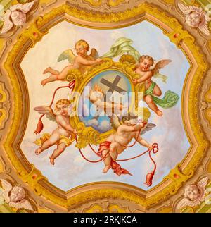 GENOVA, ITALY - MARCH 6, 2023: The fresco of angels with the cross in the church Chiesa di Santa Caterina (1888). Stock Photo