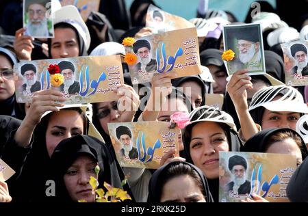 Bildnummer: 56186317  Datum: 16.10.2011  Copyright: imago/Xinhua (111016) -- TEHRAN, Oct. 16, 2011 (Xinhua) -- Women hold up posters of Iran s Supreme Leader Ayatollah Ali Khamenei during his speech in the western city of Kermanshah, Iran, Oct. 16, 2011. Khamenei said Sunday that Iran will respond strongly to any destructive act by the U.S. against the country, the semi-official Fars News Agency reported. (Xinhua/Official Website of the Iranian Supreme Leader) IRAN-TEHRAN-KHAMENEI-SPEECH PUBLICATIONxNOTxINxCHN Gesellschaft Politik xns x0x 2011 quer      56186317 Date 16 10 2011 Copyright Imago Stock Photo