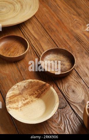 Plates and bowl on wooden background Stock Photo