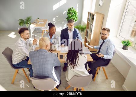 Multiracial coworkers have working together at office meeting Stock Photo