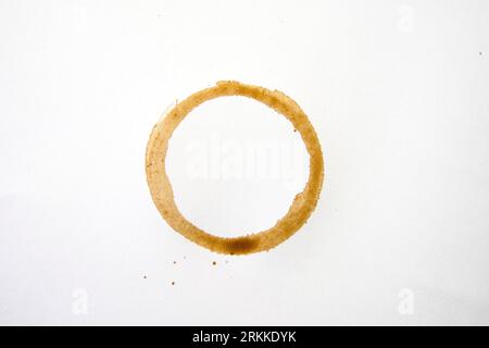 Coffee fence stain on white tablecloth Stock Photo