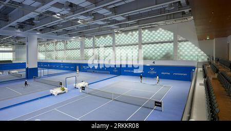 Interior tennis courts in use. 360 Mall, Kuweit City, Kuwait. Architect: CRTKL, 2021. Stock Photo