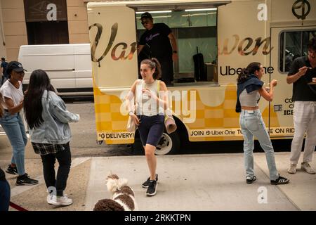 Ice cream lovers flock to the Van Leeuwen X Uber One ice cream brand activation in the NoMad neighborhood of New York on Tuesday, August 15, 2023. The multitude got treated to the exclusive BBQ Gold Cornbread Crumble flavored ice cream available through Uber One.  (© Richard B. Levine) Stock Photo