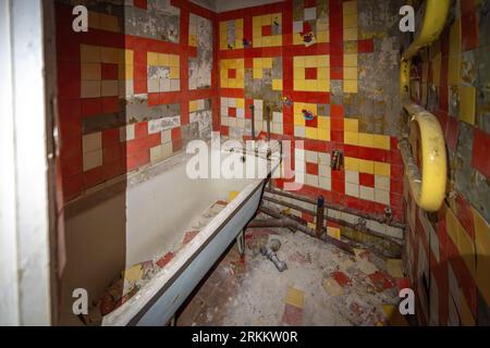 Interior of abandoned Bathroom with Bathtub in Living Apartments of Duga Radar Village - Chernobyl Exclusion Zone, Ukraine Stock Photo