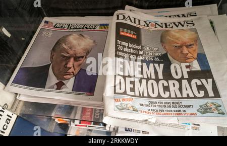 Covers of the New York Post and Daily News on Friday, August 25, 2023 both use the mug shot of former President Donald Trump from the Fulton County Sheriff’s Office. On the previous day Trump surrendered in Atlanta, GA and was booked on 13 felony charges related to his alleged efforts to overturn the election results in Georgia.  (© Richard B. Levine) Stock Photo
