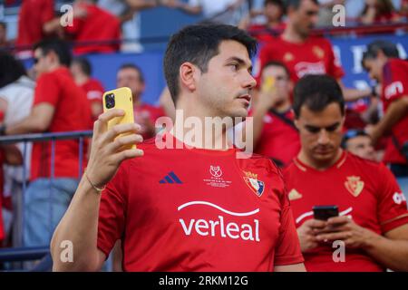 August 24, 2023, Pamplona, Foral Community of Navarre, Spain: Pamplona, Spain, 24th August, 2023: A fan of CA Osasuna with the phone during the first leg of the previous round of the UEFA Europa Conference League 2023-24 between CA Osasuna and Club Brugge at El Sadar Stadium, in Pamplona, on August 24, 2023. (Credit Image: © Alberto Brevers/Pacific Press via ZUMA Press Wire) EDITORIAL USAGE ONLY! Not for Commercial USAGE! Stock Photo