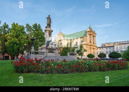 Adam Mickiewicz Monument and Carmelite Church - Warsaw, Poland Stock Photo