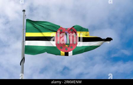 Dominica Flag - Realistic Waving Fabric Flag. Stock Photo