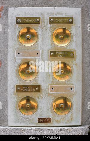 Vintage golden doorbells close-up in Venice in Italy Stock Photo