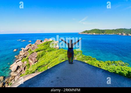 December 31st, 2018, Phuket, Thailand -A tourist poses for a photo at the scenic Similan Islands beach with blue-green waters and silver sands Stock Photo