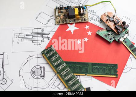 computer chip over black background with china flag and binary code inside Stock Photo