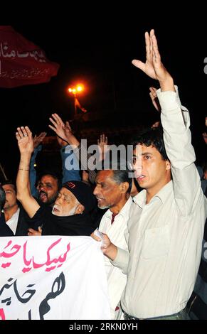 Pakistani Shiite Muslims shout religious slogans during a Muharram ...