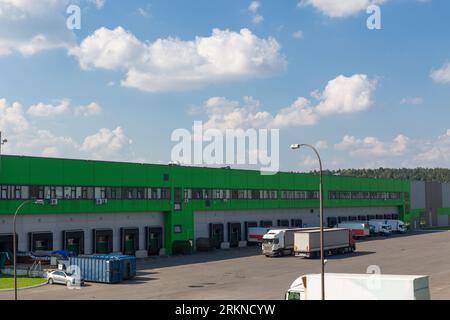 Row of loading docks with shutter doors. Warehouse gates for loading and unloading cargo in a distributed center. Loading and unloading areas for truc Stock Photo