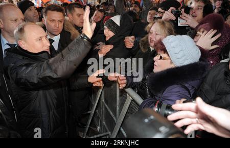 Russian President Dmitry Medvedev waves as he visits the Brest