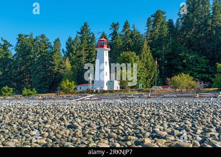 Lighthouse of Cape Mudge town by the Discovery Passage, Quadra Island, British Columbia, Canada. Stock Photo
