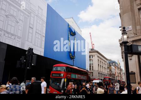 IKEA is set to open a store on Oxford Street in early 2024, the building is currently covered in scaffolding designed to look like a giant IKEA blue b Stock Photo