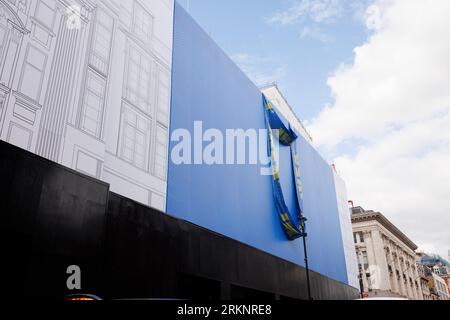 IKEA is set to open a store on Oxford Street in early 2024, the building is currently covered in scaffolding designed to look like a giant IKEA blue b Stock Photo